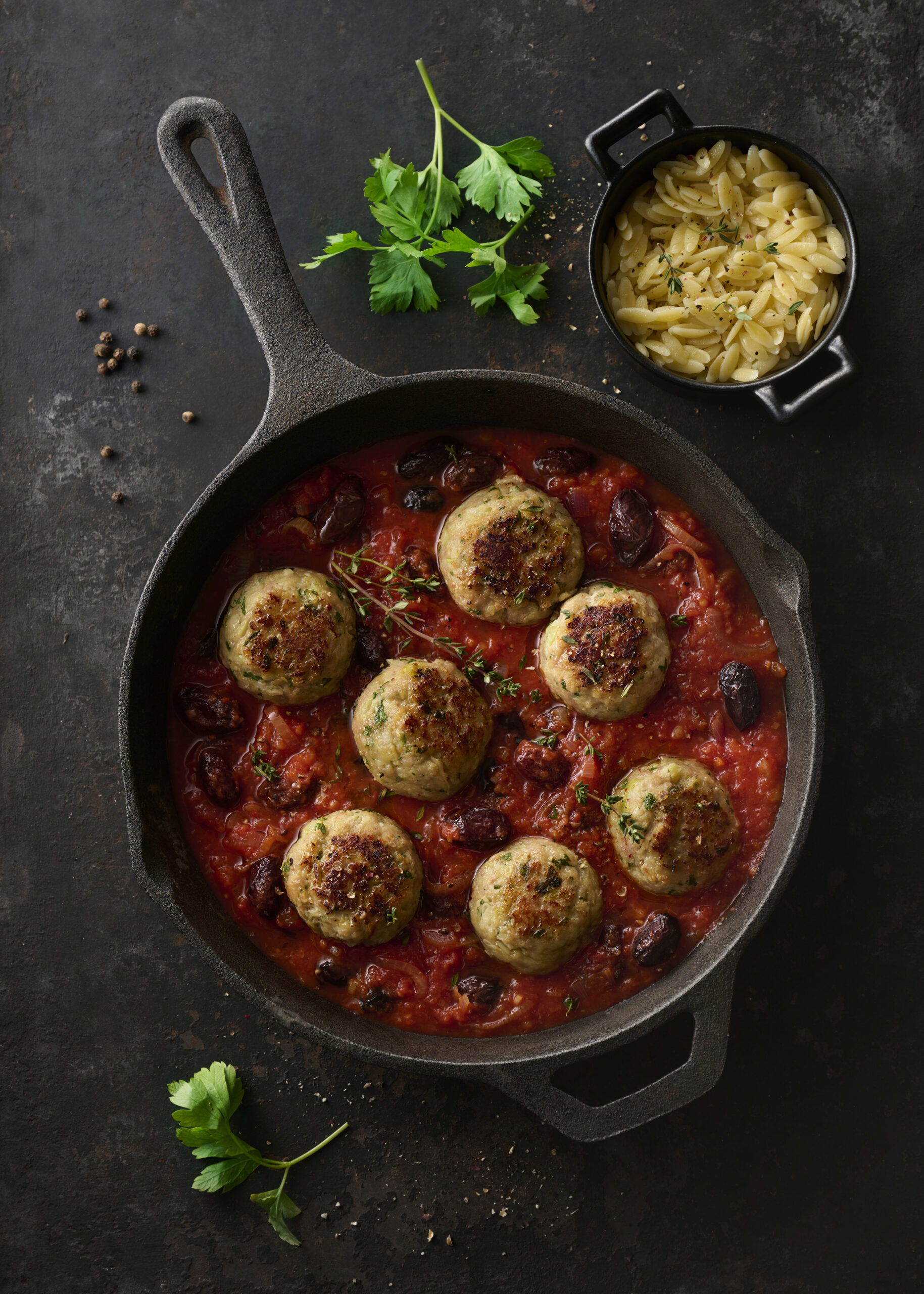 Boulettes d’épaule de veau façon Marengo, aux tomates et aux olives noires